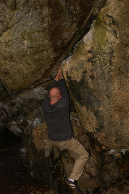 Rick climbing up the Bowder Stone